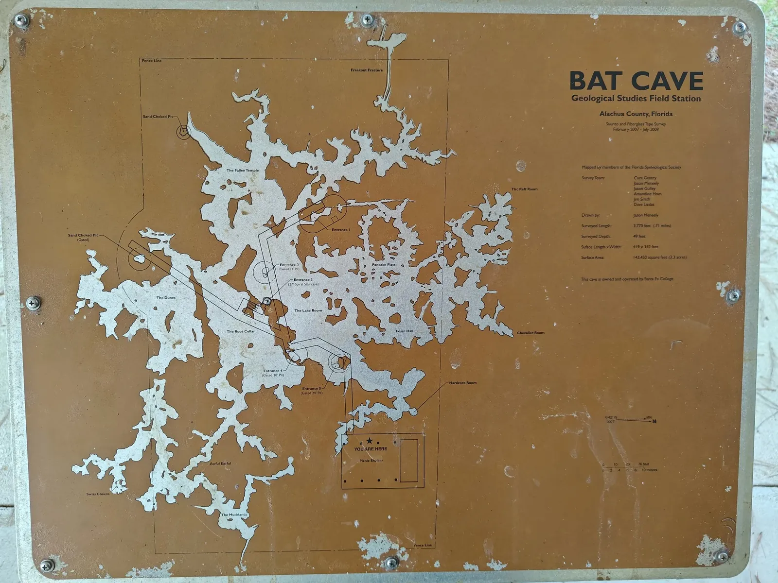 Original flat map of the Bat Cave on a sign at the entrance