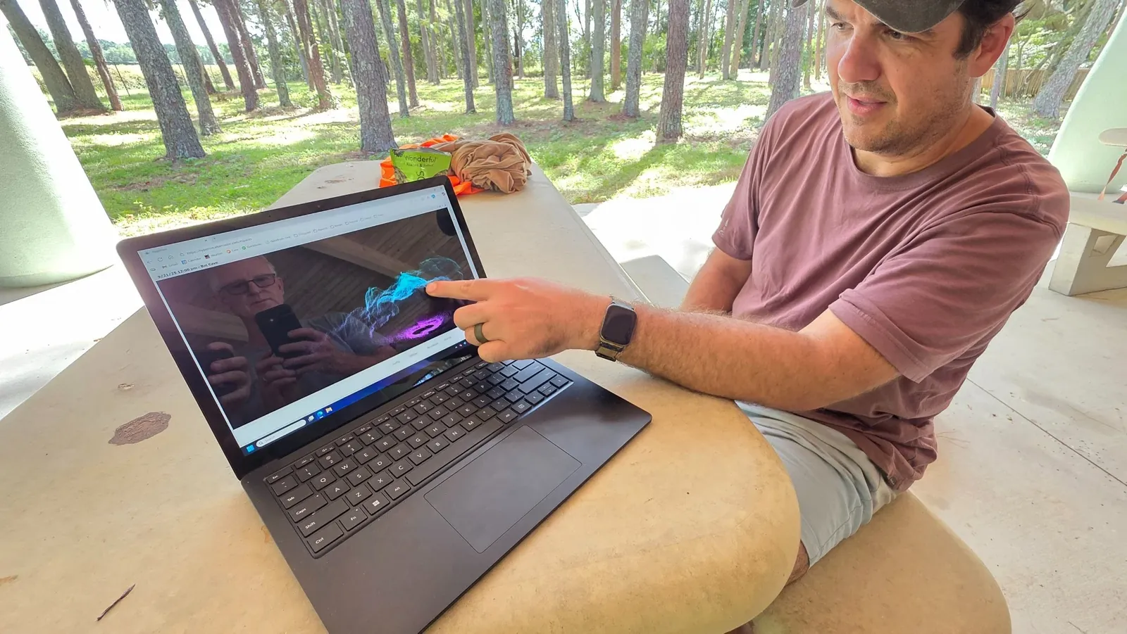 Team reviewing the final Bat Cave point cloud on a laptop