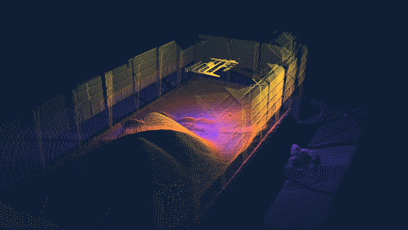 Raw EOS2 LiDAR point cloud of a stockpile inside a storage building, colored by height
